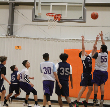 Boys playing basketball